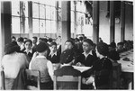Jewish teenagers celebrate a bar mitzvah in the dining hall of the Wezembeek children's home in Belgium.