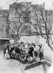 Group portrait of Jewish refugee children dressed in Purim costumes at the Orphelinat Israelite de Bruxelles children's home on the rue des Patriotes.