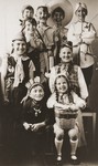Group portrait of children dressed in costumes at a Purim party.