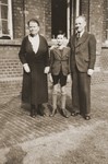 A Jewish pupil poses with two of his teachers at the Israelitische Volkschule Essen.