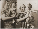 Selma Heimann and Frieda (nee Heimann) Perl hold Ellinor (now Eleanor Gerson) and Evelyn Perl (now Evelyn Pearl).