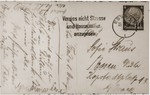 The verso of a postcard sent by Gustav Straus to his wife and son in Essen while he was en route to Dachau, following his arrest on Kristallnacht.