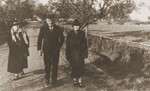 Julius and Mathilde Stern walk along a country lane with their daughter-in-law, Resi Markhoff Stern.