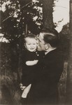 Viktor Stern holds and kisses his son, Manfred.