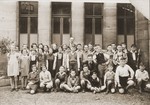 Group portrait of students at the Juedische Realschule in Fuerth with their teacher, Benno Heinemann.