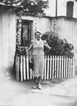 Rywka Grynberg (aunt of the donor) stands outside her parent's home in Nowa Wies.