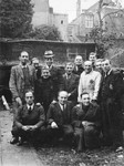 Group portrait of Dutch Jews taken in the courtyard of the Joodsche Schouwburg theater the day before their deportation.