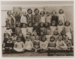 A group portrait of a class of girls at a school in Oradour.
