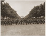American troops of the 28th Infantry Division march down the Champs Elysees, Paris, in a victory parade.