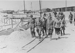 Reichsfuehrer SS Heinrich Himmler tours the Monowitz-Buna building site in the company of Max Faust (first on the left).