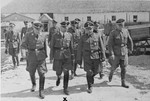 Reichsfuehrer SS Heinrich Himmler tours a Jewish labor camp in Galicia along the main supply route in the company of camp commandant, Friedrich Warzok.
