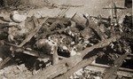 The charred corpses of prisoners burned on a pyre just prior to the liberation of the camp by the American Army.