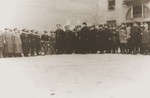 Adam Czerniakow (center), the Chairman of the Warsaw ghetto Jewish council, poses with visiting Polish police during a ceremony held in honor of Jewish policemen killed in the line of duty.