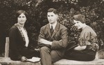 Group portrait of three Jewish siblings in Budapest.