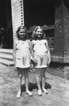 Dorottya (Dolly) and Ida Marianne (Mari) Dezsoefi  pose in the street during a resort vacation.