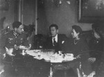 Chiune and Yukiko Sugihara dine with a German officer in Berlin.