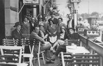 Austrian Jews at an outdoor cafe in Vienna.  

Pictured are members of the Fiedler and Goldstaub families.