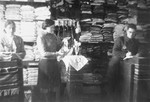 Jews working in a storeroom of a workshop in the Glubokoye ghetto.