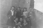 Group portrait of Jewish survivors who are members of a kibbutz hachshara located at 38 Poznanska Street in Warsaw.