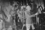 Jewish men at work in a tanning factory in the Glubokoye ghetto.