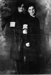 Two female cousins pose wearing armbands in the Czestochowa ghetto.