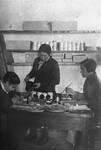 Jewish women make shoe polish at a workshop in the Glubokoye ghetto.