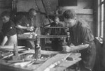Jewish men working in a carpentry workshop in the Glubokoye ghetto.