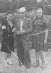 A young man poses with two young women in the Czestochowa ghetto.