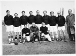 Group portrait of the members of the Schlachtensee displaced persons camp soccer team.