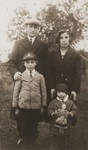 A Jewish couple poses with their two young children in Biala Rawska..