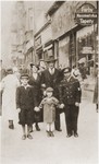 A Jewish family poses on a street in Chorzow, Poland.