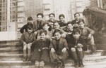 Group portrait of German-Jewish refugee children who were sent to France on a Kindertransport in the spring of 1939 on the steps of the Quincy-sous-Senart children's home near Paris.