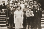 Jewish refugee youth pose on the staircase of the Château de Chabannes children's home near Limoges.