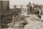 Under the supervision of American soldiers, German civilians exhume the bodies of prisoners killed by the SS in a barn just outside of Gardelegen.