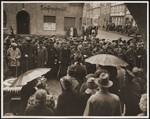 German civilians from Gardelegen gather in the town square where they receive instructions for the burial of the victims of the Gardelegen barn atrocity.