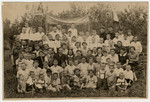 Group portrait of Polish-Jewish refugee children in an orphanage at the Pahta Abak-Kolhoz farm outside Andizhan, Uzbekistan shortly before they were repatriated to Poland.