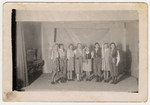 Group portrait of Jewish teenagers in costume during a performance in a children's home in Bielsko Biala.