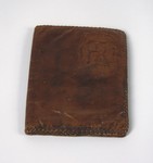 A brown, leather-tooled folio belonging to the Gondos family, who took it with them when they left Budapest aboard the Kasztner rescue train.