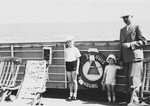 Siegfried Chraplewski poses with his two sons on the deck of the St.