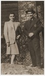 Two Jewish siblings pose in the Dabrowa ghetto wearing the yellow star.