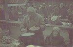 Women sell food in a market in the Lodz ghetto.