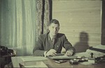 An unidentified administrator sits in his office possibly [in the Lodz ghetto].