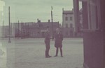 A German official [probably Biebow] talks to an SS officer in the Lodz ghetto.