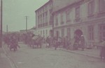 Horse-drawn wagons carry the belongings of Jews moving into the Lodz ghetto.