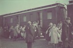 Jews board a passenger train during a deportation action in the Lodz ghetto.