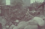 Large pile of debris in the Lodz ghetto.

Original German caption: "Litzmannstadt-getto, Altmaterial Lager" (old material warehouse), #23.
