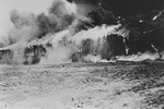 A barrack in camp no. 1 of Bergen-Belsen goes up in flames after the British Army sets it on fire  in an effort to stop a typhus epidemic.