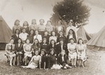 Group portrait of members of the Ezra youth movement in a "harvesting camp" outside of London, where they assisted local farmers.