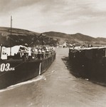 Jewish refugees from the Kladovo Transport are seen onboard two of the three vessels that are transporting them to Sabac.