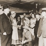 Jewish refugees from the Kladovo transport in a makeshift kitchen on board one of the vessels in Kladovo harbor.